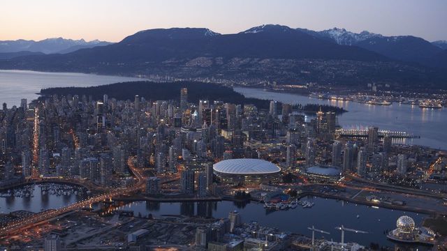 General Scenes: Winter Games Preview: Aerial scenic view of downtown skyline and hockey Olympic venues: BC Place and Canada Hockey Place. Vancouver, Canada 2/15/2009 CREDIT: Simon Bruty
