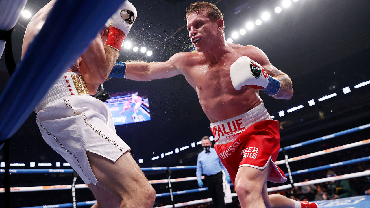 SAN ANTONIO, TEXAS - DECEMBER 19: In this handout image provided by Matchroom, Canelo Alvarez punches Callum Smith during their super middleweight title bout at the Alamodome on December 19, 2020 in San Antonio, Texas.
