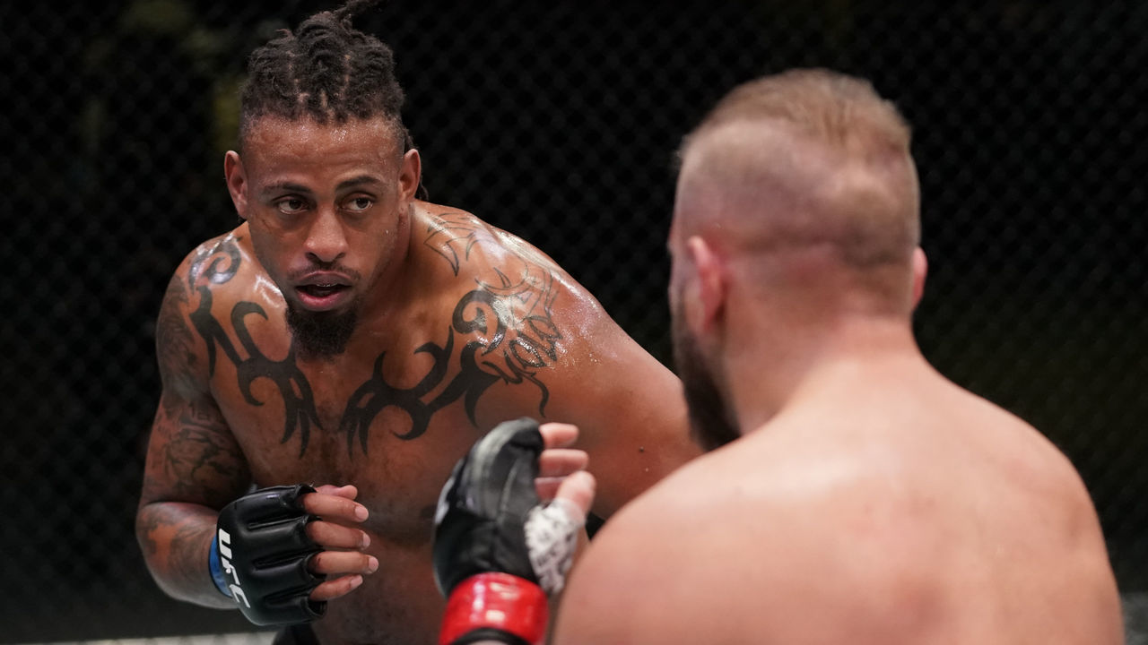 LAS VEGAS, NEVADA - DECEMBER 19: (L-R) Greg Hardy battles Marcin Tybura of Poland in a heavyweight fight during the UFC Fight Night event at UFC APEX on December 19, 2020 in Las Vegas, Nevada.