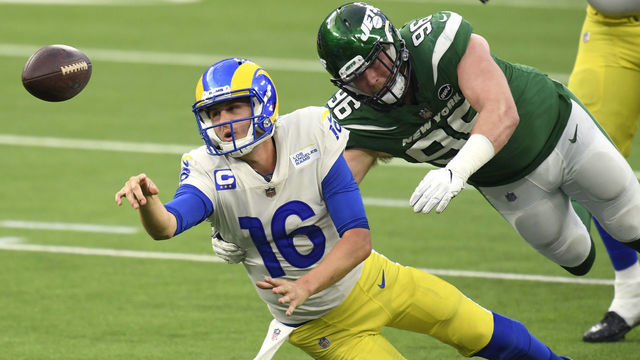 INGLEWOOD, CALIFORNIA - DECEMBER 20: Jared Goff #16 of the Los Angeles Rams throws as he is brought down by Henry Anderson #96 of the New York Jets during the fourth quarter of a game at SoFi Stadium on December 20, 2020 in Inglewood, California.