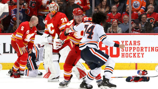 CALGARY, ALBERTA -FEBRUARY 01: Matthew Tkachuk #19 of the Calgary Flames fights Ethan Bear #74 of the Edmonton Oilers at Scotiabank Saddledome on February 01, 2020 in Calgary, Canada.
