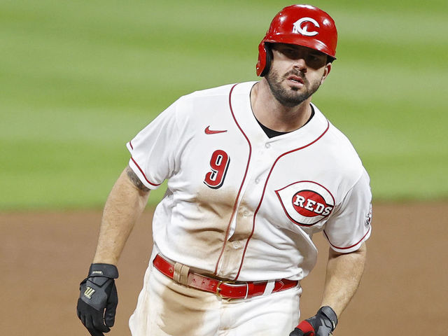 CINCINNATI, OH - SEPTEMBER 21: Mike Moustakas #9 of the Cincinnati Reds rounds the bases after hitting a three-run home run in the eighth inning of the game against the Milwaukee Brewers at Great American Ball Park on September 21, 2020 in Cincinnati, Ohio. The Reds won 6-3.
