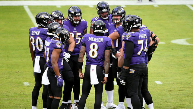 BALTIMORE, MARYLAND - DECEMBER 20: Quarterback Lamar Jackson #8 of the Baltimore Ravens calls a play in the huddle during the first half against the Jacksonville Jaguars at M&T Bank Stadium on December 20, 2020 in Baltimore, Maryland.