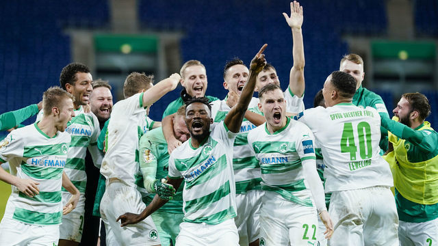 22 December 2020, Baden-Wuerttemberg, Sinsheim: Football: DFB Cup, TSG 1899 Hoffenheim - SpVgg Greuther Fürth, 2nd round, PreZero Arena. Fürth's team celebrates victory. Photo: Uwe Anspach/dpa - IMPORTANT NOTE: In accordance with the regulations of the DFL Deutsche Fußball Liga and/or the DFB Deutscher Fußball-Bund, it is prohibited to use or have used photographs taken in the stadium and/or of the match in the form of sequence pictures and/or video-like photo series.