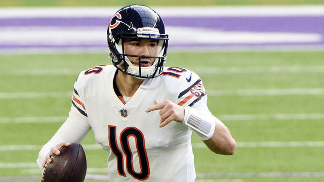 MINNEAPOLIS, MINNESOTA - DECEMBER 20: Mitchell Trubisky #10 of the Chicago Bears scrambles with the ball during the first half against the Minnesota Vikings at U.S. Bank Stadium on December 20, 2020 in Minneapolis, Minnesota.