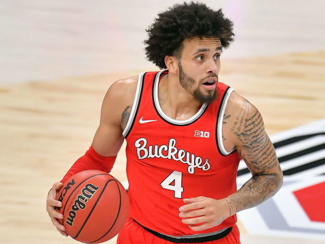 CLEVELAND, OHIO - DECEMBER 19: Duane Washington Jr. #4 of the Ohio State Buckeyes drives down court during the first half against the UCLA Bruins at Rocket Mortgage Fieldhouse on December 19, 2020 in Cleveland, Ohio.