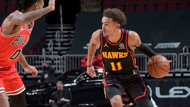 CHICAGO, IL - DECEMBER 23: Trae Young #11 of the Atlanta Hawks dribbles the ball against the Chicago Bulls at the United Center on December 23, 2020 in Chicago, Illinois. NOTE TO USER: User expressly acknowledges and agrees that, by downloading and/or using this Photograph, user is consenting to the terms and conditions of the Getty Images License Agreement. Mandatory Copyright Notice: Copyright 2020 NBAE