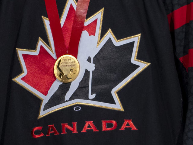 KELOWNA, BC - JANUARY 8: Kelowna Rockets' president and general manager, Bruce Hamilton congratulates team captain Nolan Foote stand on the ice at Prospera Place upon his return from winning gold with Team Canada at the IIHF World Junior Hockey Championships on January 8, 2020 in Kelowna, Canada.