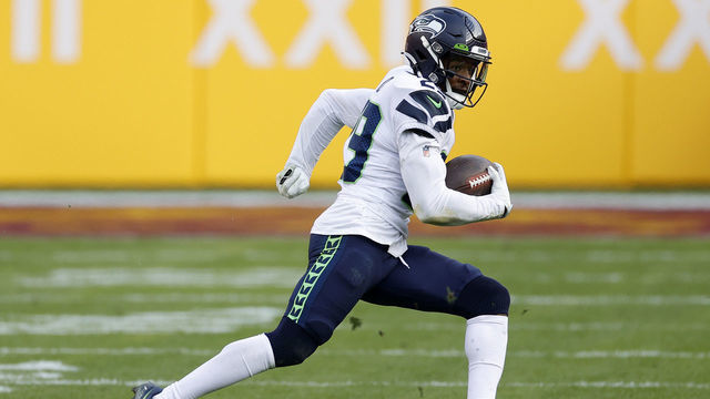 LANDOVER, MARYLAND - DECEMBER 20: D.J. Reed Jr. #29 of the Seattle Seahawks intercepts a pass against the Washington Football Team at FedExField on December 20, 2020 in Landover, Maryland.