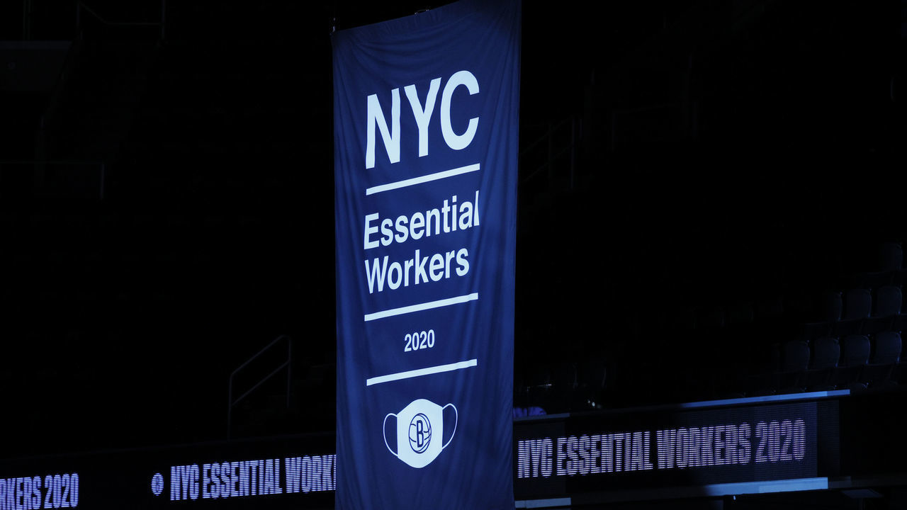 NEW YORK, NEW YORK - DECEMBER 22: The Brooklyn Nets raise a banner to the rafters honoring New York City's essential workers during the COVID-19 pandemic before the first half against the Golden State Warriors at Barclays Center on December 22, 2020 in the Brooklyn borough of New York City. NOTE TO USER: User expressly acknowledges and agrees that, by downloading and/or using this photograph, user is consenting to the terms and conditions of the Getty Images License Agreement.
