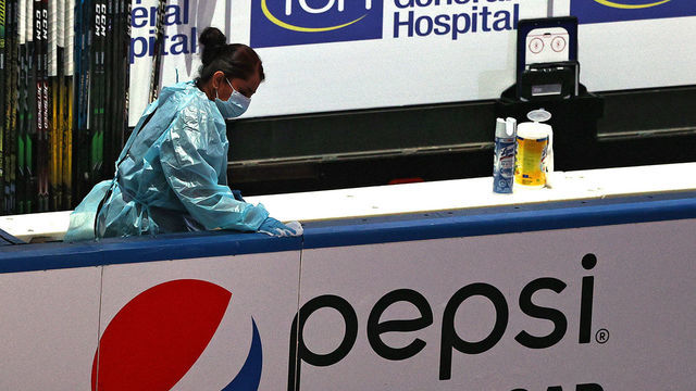 TORONTO, ONTARIO - AUGUST 13: Staff member disinfect the bench with lysol due to concerns of the spread of the coronavirus following the second period of Game Two of the Eastern Conference First Round between the Tampa Bay Lightning and the Columbus Blue Jackets during the 2020 NHL Stanley Cup Playoffs at Scotiabank Arena on August 13, 2020 in Toronto, Ontario.