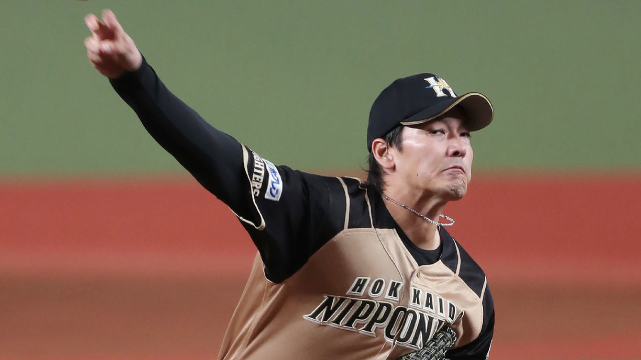 Nippon Ham starter Kohei Arihara pitches the ball during the Japanese professional baseball match between Seibu and Nippon Ham at the Metlife Dome in Tokorozawa, Saitama prefecture on June 19, 2020. - Japan's professional baseball season began behind closed doors on June 19, three months after the originally scheduled start as the country gradually rolls back its anti-coronavirus measures.