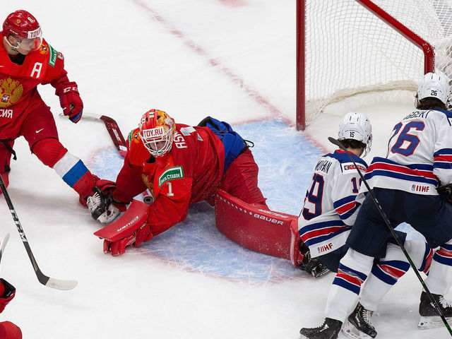 EDMONTON, AB - DECEMBER 25: Goaltender Yaroslav Askarov #1 of Russia sprawls out as Patrick Moynihan #19 and Landon Slaggert #26 of the United States look for a shot during the 2021 IIHF World Junior Championship at Rogers Place on December 25, 2020 in Edmonton, Canada.