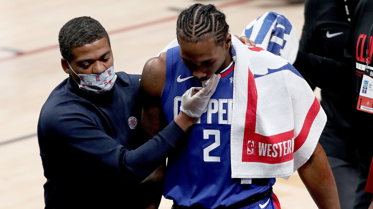 DENVER, COLORADO - DECEMBER 25: Kawhi Leonard #2 of the Los Angeles Clippers leaves the game after being injured against the Denver Nuggets in the fourth quarter at Ball Arena on December 25, 2020 in Denver, Colorado.