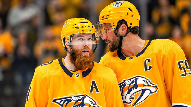 NASHVILLE, TN - DECEMBER 14: Roman Josi #59 and Ryan Ellis #4 of the Nashville Predators defend against the Dallas Stars at Bridgestone Arena on December 14, 2019 in Nashville, Tennessee.