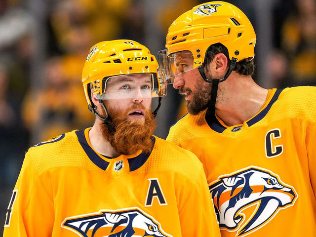 NASHVILLE, TN - DECEMBER 14: Roman Josi #59 and Ryan Ellis #4 of the Nashville Predators defend against the Dallas Stars at Bridgestone Arena on December 14, 2019 in Nashville, Tennessee.