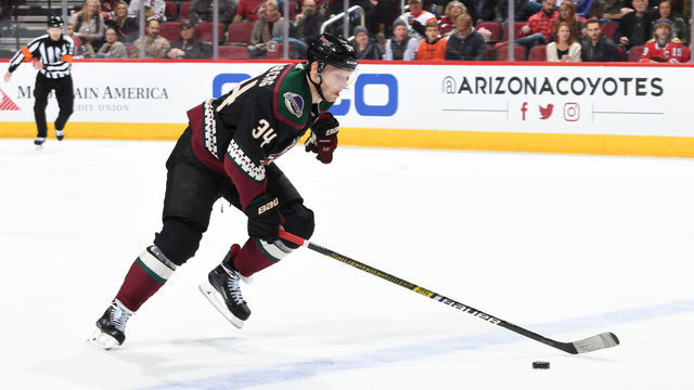 GLENDALE, ARIZONA - DECEMBER 12: Carl Soderberg #34 of the Arizona Coyotes skates with the puck against the Chicago Blackhawks at Gila River Arena on December 12, 2019 in Glendale, Arizona.