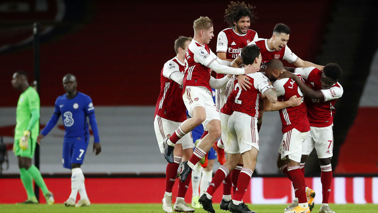 LONDON, ENGLAND - DECEMBER 26: Granit Xhaka of Arsenal celebrates with teammates Rob Holding, Emile Smith Rowe, Mohamed Elneny, Hector Bellerin, Gabriel Martinelli, Alexandre Lacazette and Bukayo Saka after scoring his team's second goal during the Premier League match between Arsenal and Chelsea at Emirates Stadium on December 26, 2020 in London, England. The match will be played without fans, behind closed doors as a Covid-19 precaution.