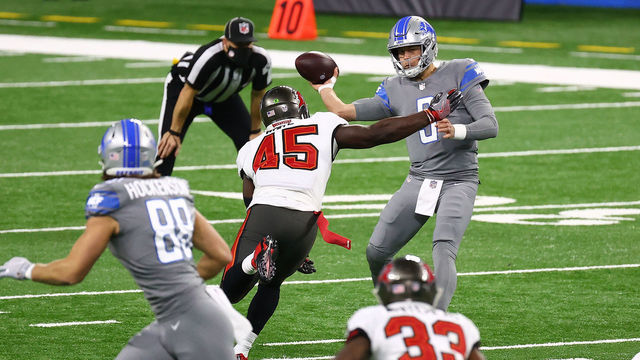 DETROIT, MICHIGAN - DECEMBER 26: Matthew Stafford #9 of the Detroit Lions reacts in pain after a sack during the first quarter of a game against the Tampa Bay Buccaneers at Ford Field on December 26, 2020 in Detroit, Michigan.