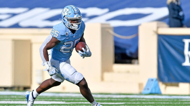 CHAPEL HILL, NORTH CAROLINA - DECEMBER 05: Javonte Williams #25 of the North Carolina Tar Heels runs against the Western Carolina Catamounts during their game at Kenan Stadium on December 05, 2020 in Chapel Hill, North Carolina. The Tar Heels won 49-9.