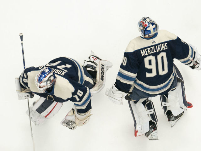 COLUMBUS, OH - DECEMBER 29: Columbus Blue Jackets goaltender Joonas Korpisalo (70) and Columbus Blue Jackets goaltender Elvis Merzlikins (90) skates in warm-ups prior to the game between the Columbus Blue Jackets and the Chicago Blackhawks at Nationwide Arena in Columbus, Ohio on December 29, 2019.