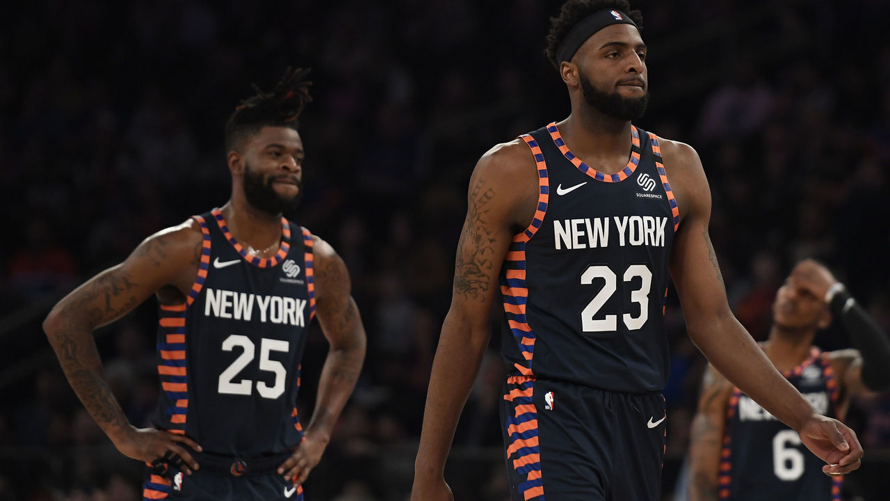 NEW YORK, NEW YORK - JANUARY 12: Mitchell Robinson #23 and Reggie Bullock #25 of the New York Knicks look on during the first half of the game against the Miami Heat at Madison Square Garden on January 12, 2020 in New York City.