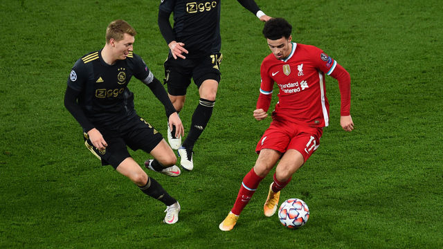 LIVERPOOL, ENGLAND - DECEMBER 01: (SUN OUT,THE SUN ON SUNDAY OUT)Curtis Jones of Liverpool with Perr Schuurs of Ajax during the UEFA Champions League Group D stage match between Liverpool FC and Ajax Amsterdam at Anfield on December 01, 2020 in Liverpool, England. Sporting stadiums around the UK remain under strict restrictions due to the Coronavirus Pandemic as Government social distancing laws prohibit fans inside venues resulting in games being played behind closed doors.