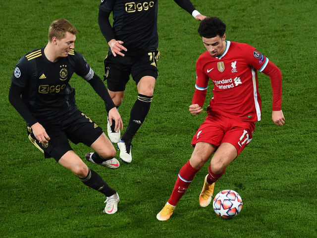 LIVERPOOL, ENGLAND - DECEMBER 01: (SUN OUT,THE SUN ON SUNDAY OUT)Curtis Jones of Liverpool with Perr Schuurs of Ajax during the UEFA Champions League Group D stage match between Liverpool FC and Ajax Amsterdam at Anfield on December 01, 2020 in Liverpool, England. Sporting stadiums around the UK remain under strict restrictions due to the Coronavirus Pandemic as Government social distancing laws prohibit fans inside venues resulting in games being played behind closed doors.