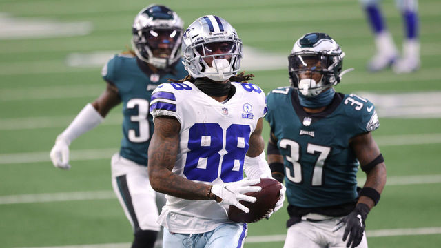 ARLINGTON, TEXAS - DECEMBER 27: CeeDee Lamb #88 of the Dallas Cowboys scores a touchdown in the third quarter against the Philadelphia Eagles at AT&T Stadium on December 27, 2020 in Arlington, Texas.