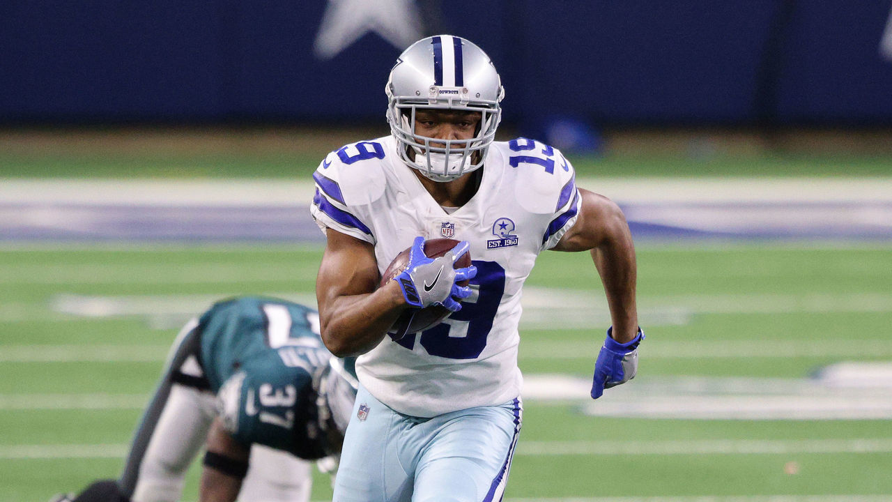 ARLINGTON, TEXAS - DECEMBER 27: Amari Cooper #19 of the Dallas Cowboys runs after making a catch in the third quarter against Grayland Arnold #37 of the Philadelphia Eagles at AT&T Stadium on December 27, 2020 in Arlington, Texas.