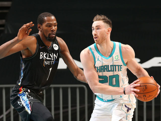 CHARLOTTE, NC - DECEMBER 27: Gordon Hayward #20 of the Charlotte Hornets looks to pass the ball while Kevin Durant #7 of the Brooklyn Nets plays defense during the game on December 27, 2020 at Spectrum Center in Charlotte, North Carolina. Mandatory Copyright Notice: Copyright 2020 NBAE