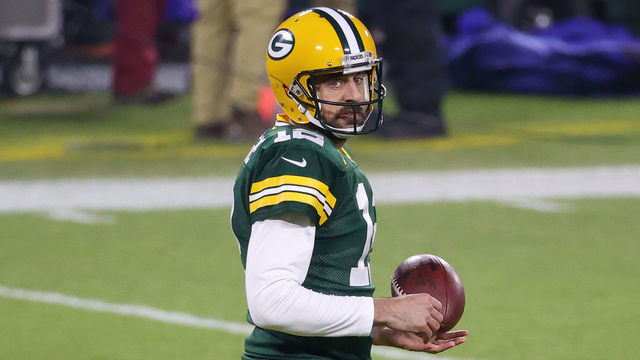 GREEN BAY, WISCONSIN - DECEMBER 19: Aaron Rodgers #12 of the Green Bay Packers warms up before the game against the Carolina Panthers at Lambeau Field on December 19, 2020 in Green Bay, Wisconsin.