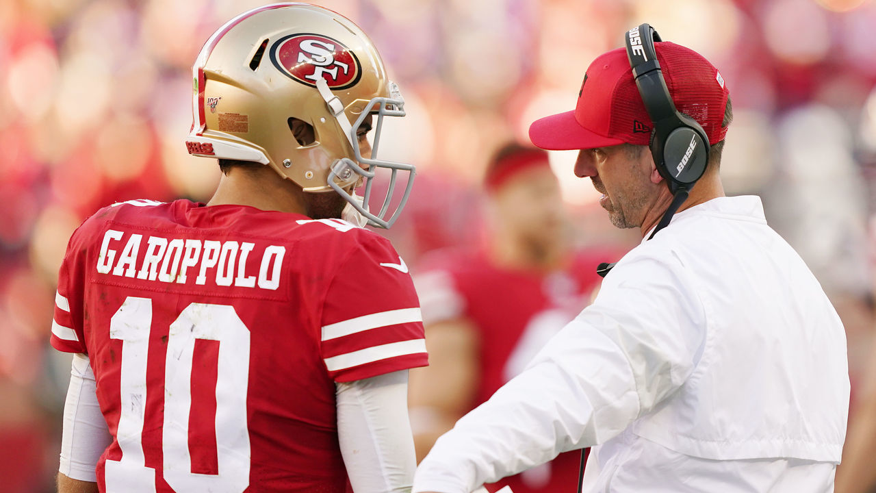 SANTA CLARA, CALIFORNIA - JANUARY 11: Jimmy Garoppolo #10 speaks with head coach Kyle Shanahan of the San Francisco 49ers during the NFC Divisional Round Playoff game against the Minnesota Vikings at Levi's Stadium on January 11, 2020 in Santa Clara, California.
