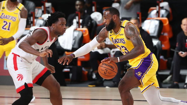 Orlando, FL - AUGUST 1: LeBron James #23 of the Los Angeles Lakers drives to the basket against the Toronto Raptors on August 1, 2020 at The Arena at ESPN Wide World of Sports in Orlando, Florida. NOTE TO USER: User expressly acknowledges and agrees that, by downloading and/or using this Photograph, user is consenting to the terms and conditions of the Getty Images License Agreement. Mandatory Copyright Notice: Copyright 2020 NBAE