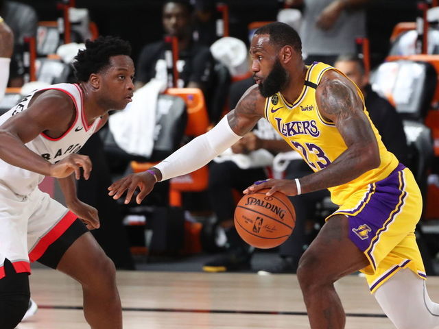 Orlando, FL - AUGUST 1: LeBron James #23 of the Los Angeles Lakers drives to the basket against the Toronto Raptors on August 1, 2020 at The Arena at ESPN Wide World of Sports in Orlando, Florida. NOTE TO USER: User expressly acknowledges and agrees that, by downloading and/or using this Photograph, user is consenting to the terms and conditions of the Getty Images License Agreement. Mandatory Copyright Notice: Copyright 2020 NBAE