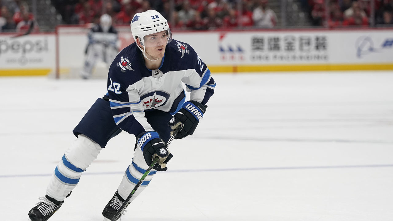 WASHINGTON, DC - FEBRUARY 25: Jack Roslovic #28 of the Winnipeg Jets skates with the puck against the Washington Capitals in the second period at Capital One Arena on February 25, 2020 in Washington, DC.