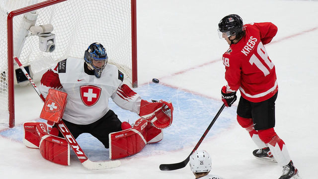 EDMONTON, AB - DECEMBER 29: Peyton Krebs #18 of Canada takes a shot on goaltender Noah Patenaude #1 of Switzerland during the 2021 IIHF World Junior Championship at Rogers Place on December 29, 2020 in Edmonton, Canada.