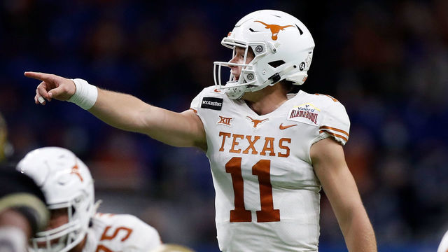SAN ANTONIO, TEXAS - DECEMBER 29: Sam Ehlinger #11 of the Texas Longhorns signals at the line of scrimmage in the second quarter against the Colorado Buffaloes during the Valero Alamo Bowl at the Alamodome on December 29, 2020 in San Antonio, Texas.