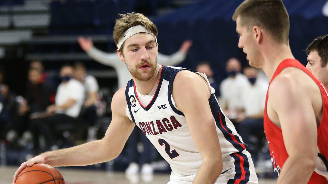 SPOKANE, WASHINGTON - DECEMBER 29: Drew Timme #2 of the Gonzaga Bulldogs controls the ball against Trevon Allfrey #40 of the Dixie State Trailblazers in the first half at McCarthey Athletic Center on December 29, 2020 in Spokane, Washington.