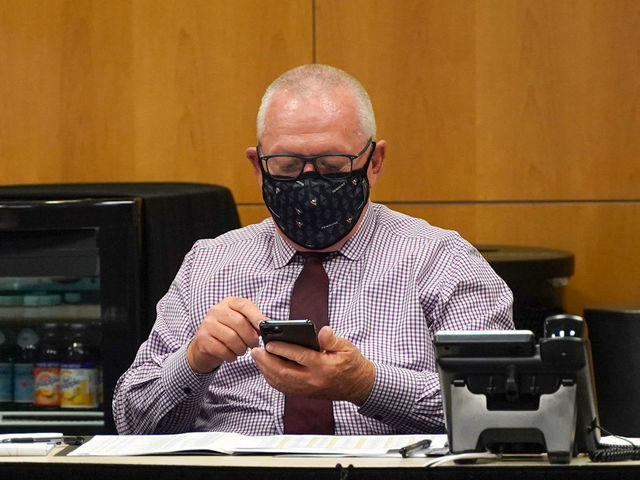 PITTSBURGH, PENNSLYVANIA- OCTOBER 07: General manager Jim Rutherford of the Pittsburgh Penguins sits at the draft table during rounds 2-7 of the 2020 NHL Entry Draft at PPG Paints Arena on October 07, 2020 in Pittsburgh, Pennsylvania. The 2020 NHL Draft was held virtually due to the ongoing Coronavirus pandemic.