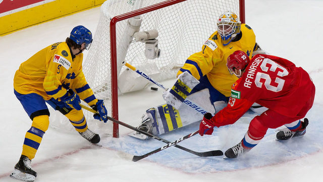 EDMONTON, AB - DECEMBER 30: Yegor Afanasiev #23 of Russia scores a goal against goaltender Jesper Wallstedt #1 of Sweden during the 2021 IIHF World Junior Championship at Rogers Place on December 30, 2020 in Edmonton, Canada.