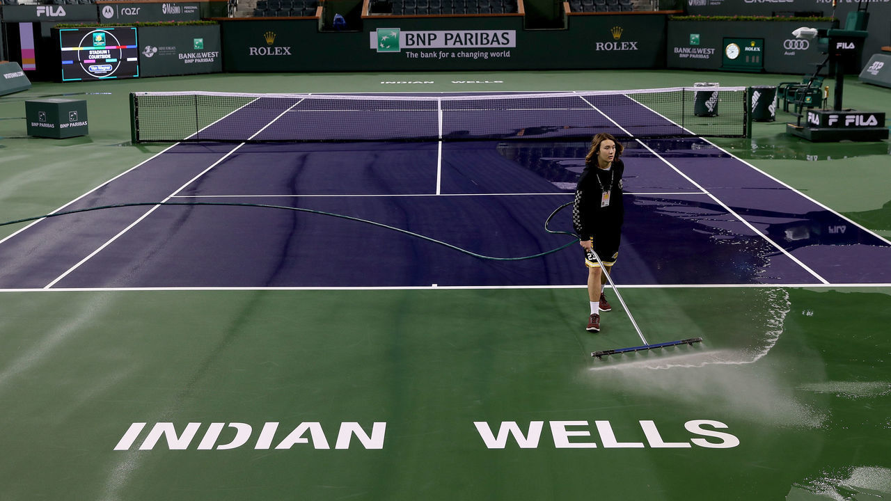 INDIAN WELLS, CALIFORNIA - MARCH 08: Courtmaster Jeffrey Brooker cleans the center court at the Indian Wells Tennis Garden on March 08, 2020 in Indian Wells, California. The BNP Paribas Open was cancelled by the Riverside County Public Health Department, as county officials declared a public health emergency when a case of coronavirus (COVID-19) was confirmed in the area.