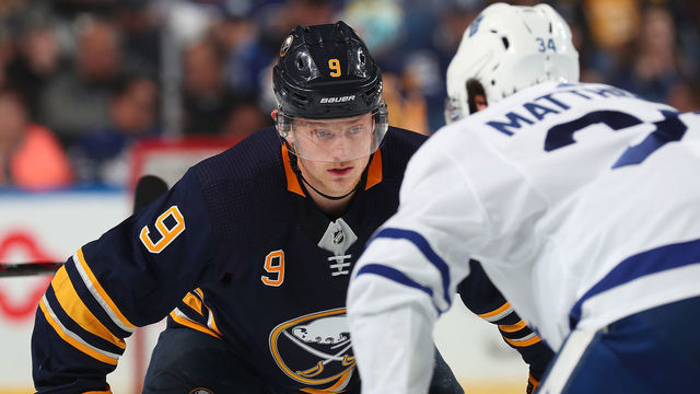BUFFALO, NY - MARCH 20: Jack Eichel #9 of the Buffalo Sabres prepares for a face-off against Auston Matthews #34 of the Toronto Maple Leafs during an NHL game on March 20, 2019 at KeyBank Center in Buffalo, New York.