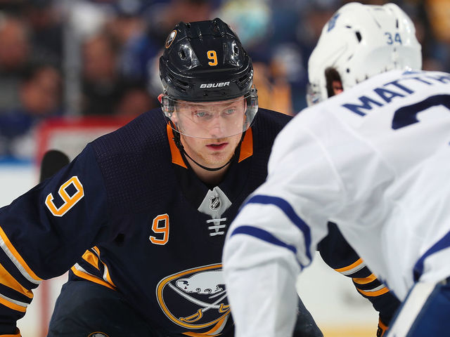 BUFFALO, NY - MARCH 20: Jack Eichel #9 of the Buffalo Sabres prepares for a face-off against Auston Matthews #34 of the Toronto Maple Leafs during an NHL game on March 20, 2019 at KeyBank Center in Buffalo, New York.