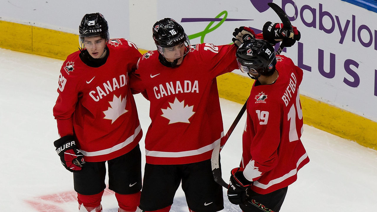 EDMONTON, AB - DECEMBER 29: Jack Quinn #29, Ryan Suzuki #16 and Quinton Byfield #19 of Canada celebrate Suzuki's goal as Cedric Fiedler #23 of Switzerland skates off during the 2021 IIHF World Junior Championship at Rogers Place on December 29, 2020 in Edmonton, Canada.