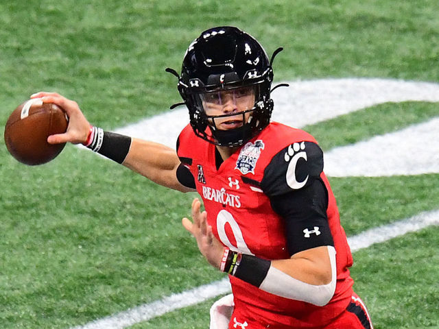 ATLANTA, GEORGIA - JANUARY 01: Desmond Ritter #9 of the Cincinnati Bearcats passes against the Georgia Bulldogs during Chick-fil-A Peach Bowl at Mercedes-Benz Stadium on January 01, 2021 in Atlanta, Georgia. Desmond Ritter