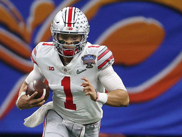 NEW ORLEANS, LOUISIANA - JANUARY 01: Justin Fields #1 of the Ohio State Buckeyes carries the ball against the Clemson Tigers in the first half during the College Football Playoff semifinal game at the Allstate Sugar Bowl at Mercedes-Benz Superdome on January 01, 2021 in New Orleans, Louisiana.