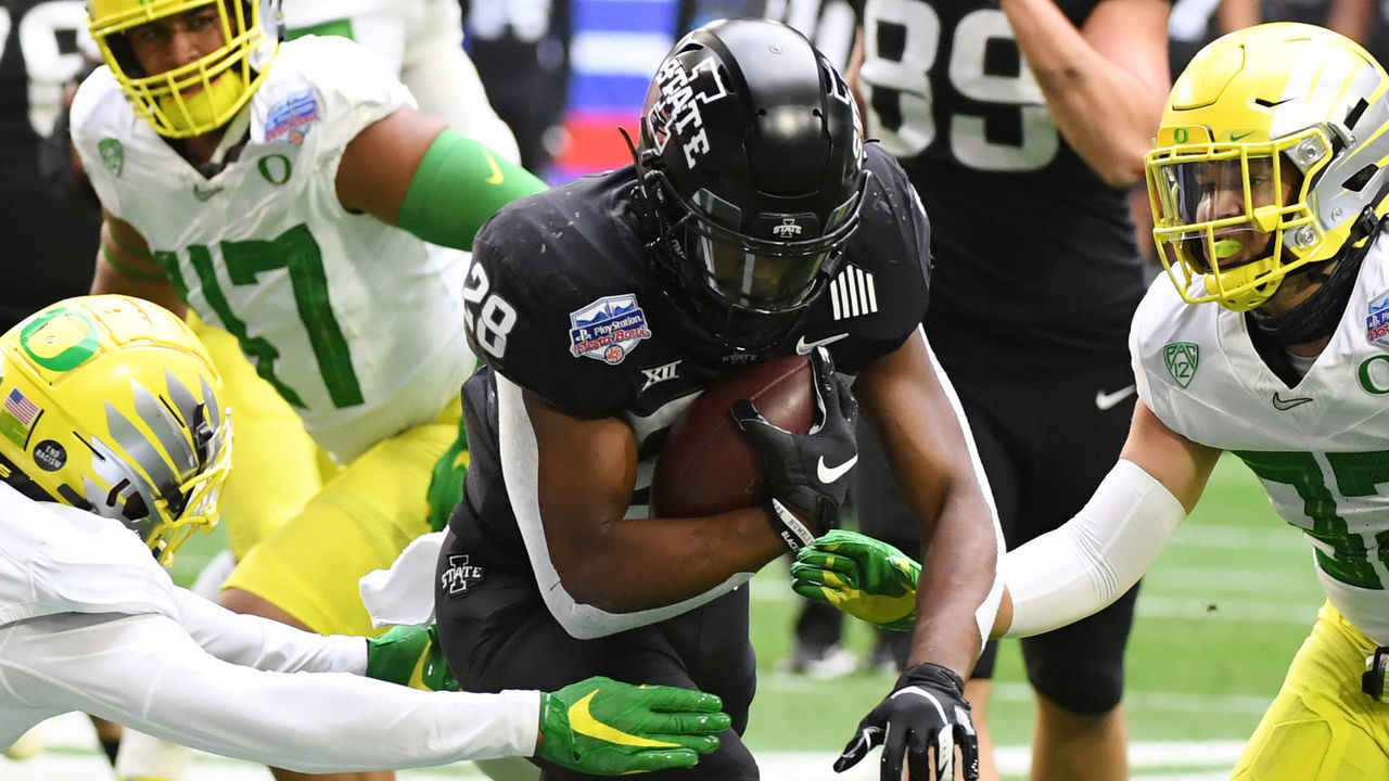 GLENDALE, ARIZONA - JANUARY 02: Breece Hall #28 of the Iowa State Cyclones runs with the ball against the Oregon Ducks during the first quarter of the Playstation Fiesta Bowl at State Farm Stadium on January 02, 2021 in Glendale, Arizona.