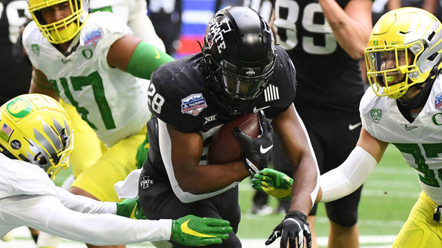 GLENDALE, ARIZONA - JANUARY 02: Breece Hall #28 of the Iowa State Cyclones runs with the ball against the Oregon Ducks during the first quarter of the Playstation Fiesta Bowl at State Farm Stadium on January 02, 2021 in Glendale, Arizona.