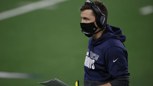 ARLINGTON, TEXAS - NOVEMBER 26: Offensive coordinator Kellen Moore of the Dallas Cowboys looks on during the second quarter of a game against the Washington Football Team at AT&T Stadium on November 26, 2020 in Arlington, Texas.